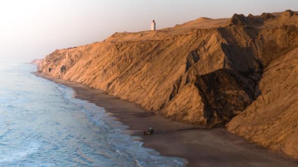 Rubjerg Knude Lighthouse view with cliffs and sea, North Jutland